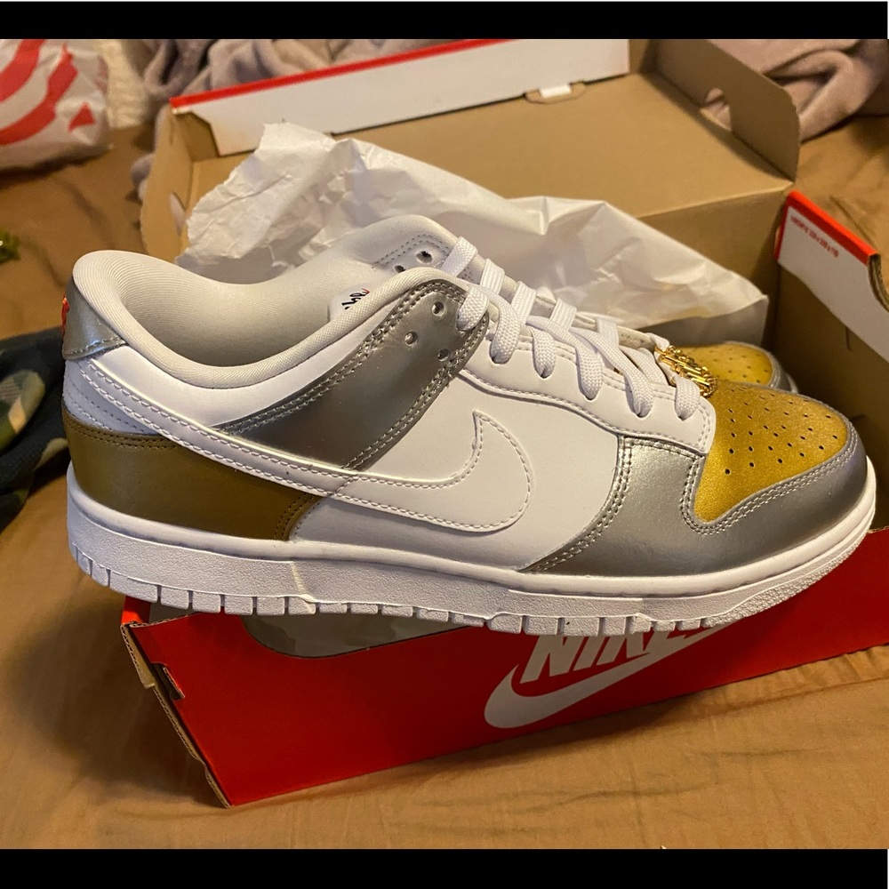 Brand new Woman’s Nike dunk low tops gold silver-white size 9.5